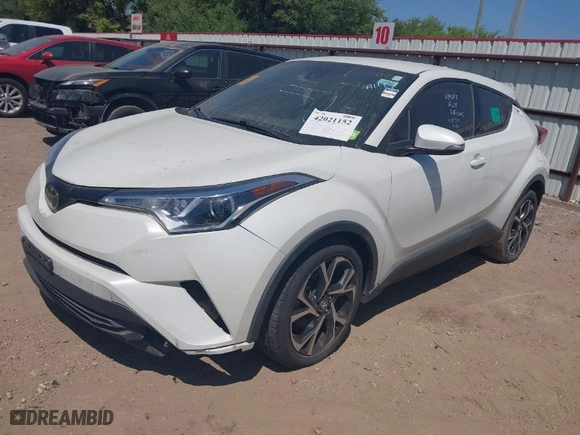 2019 Toyota C-HR XLE with VIN JTNKHMBX7K1023674, listed as a IAAI auction lot 42021152 with 106,450 mi miles. Bid and sale history available at carsss.com. Image 2.