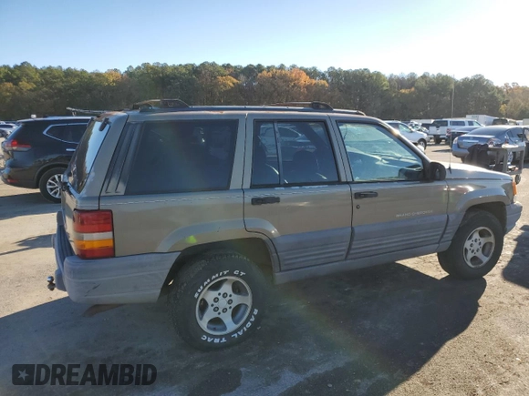 1997 Jeep Grand Cherokee TSi with VIN 1J4FX58S4VC516340, listed as a Copart auction lot 84409044 with 256,300 mi miles and Clean Title. Bid and sale history available at carsss.com. Image 3.