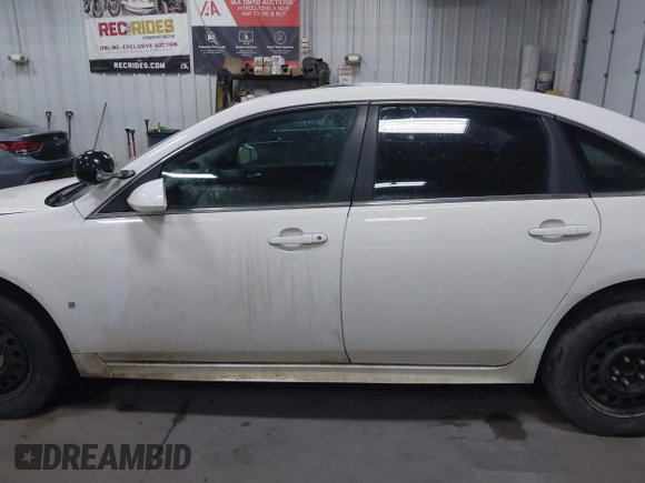 2009 Chevrolet Impala Police Police z VIN 2G1WS57M491315291, wystawiony jako IAAI lot #41877060 z przebiegiem 184 460 mil mil oraz . Historia ofert i sprzedaży dostępna na DreamBid. Obrazek 12.
