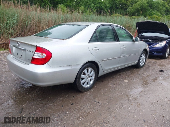 2002 Toyota Camry XLE z VIN JTDBF30K420083381, wystawiony jako IAAI lot #42368073 z przebiegiem 148 746 mil mil oraz . Historia ofert i sprzedaży dostępna na DreamBid. Obrazek 4.