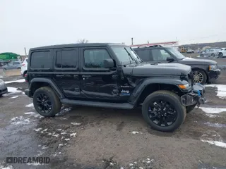 2022 Jeep Wrangler 4xe Unlimited Sahara with VIN 1C4JJXP66NW101035, listed as a IAAI auction lot 41528135 with 17,943 mi miles. Bid and sale history available at carsss.com. Image 13.