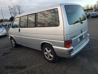 2003 Volkswagen EuroVan MV с VIN WV2MB47053H002505, выставлен на аукционе Copart как лот 83840884 с пробегом 250 786 миль миль и Чистый • Clean title. История ставок и продаж доступна на DreamBid. Изображение 2.