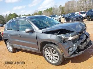 2015 Volkswagen Tiguan SE z VIN WVGBV7AXXFW503955, wystawiony jako IAAI lot #41730076 z przebiegiem 146 446 mil mil oraz . Historia ofert i sprzedaży dostępna na DreamBid. Obrazek 14.