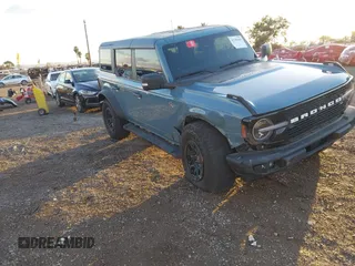 2022 Ford Bronco z VIN 1FMEE5DP3NLB22848, wystawiony jako IAAI lot #41389445 z przebiegiem 30 043 mil mil oraz . Historia ofert i sprzedaży dostępna na DreamBid. Obrazek 1.