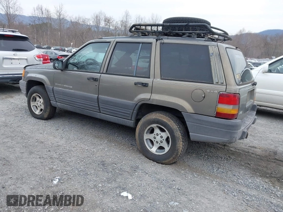1996 Jeep Grand Cherokee with VIN 1J4EZ58S1TC112995, listed as a IAAI auction lot 41706966 with 356,727 mi miles and . Bid and sale history available at DreamBid. Image 3.