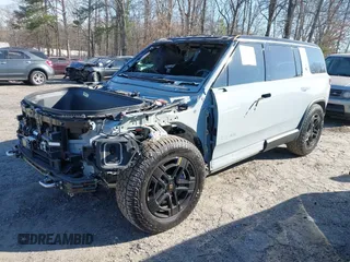 2024 Rivian R1S Adventure with VIN 7PDSGBBA8RN043516, listed as a IAAI auction lot 41675732 with 1 mi miles. Bid and sale history available at carsss.com. Image 2.