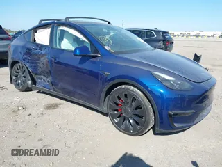 2022 Tesla Model Y Performance z VIN 7SAYGDEF3NF465967, wystawiony jako IAAI lot #41278626 z przebiegiem 22 884 mil mil oraz . Historia ofert i sprzedaży dostępna na DreamBid. Obrazek 1.