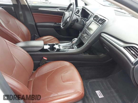 2016 Ford Fusion Titanium Hybrid with VIN 3FA6P0RU3GR190355, listed as a IAAI auction lot 42384309 with 157,172 mi miles and . Bid and sale history available at DreamBid. Image 5.