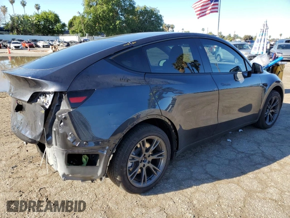 2024 Tesla Model Y with VIN 7SAYGDED3RF151031, listed as a Copart auction lot 49494165 with 7,503 mi miles and Salvage Title. Bid and sale history available at DreamBid. Image 3.