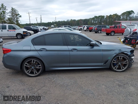 2019 BMW 5 Series M550i xDrive with VIN WBAJB9C57KB289439, listed as a IAAI auction lot 40634389 with 85,992 mi miles and . Bid and sale history available at DreamBid. Image 14.