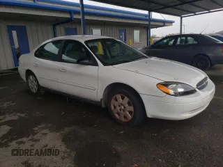 2003 Ford Taurus LX Standard with VIN 1FAFP52U53G280700, listed as a Copart auction lot 87488014 with 128,020 mi miles and Salvage title. Bid and sale history available at DreamBid. Image 4.