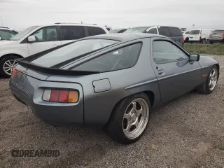 1983 Porsche 928 z VIN WP0ZZZ92ZDS841622, wystawiony jako Copart lot #76995304 z przebiegiem 83 862 mil mil oraz Szkody całkowita. Historia ofert i sprzedaży dostępna na DreamBid. Obrazek 3.