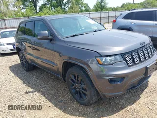 2018 Jeep Grand Cherokee Laredo E with VIN 1C4RJFAG3JC309125, listed as a IAAI auction lot 42395053 with 104,769 mi miles and . Bid and sale history available at DreamBid. Image 1.