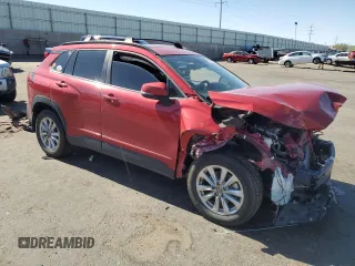 2022 Toyota Corolla Cross LE with VIN 7MUCAABG8NV008867, listed as a Copart auction lot 57232415 with 48,670 mi miles and Salvage title. Bid and sale history available at DreamBid. Image 4.