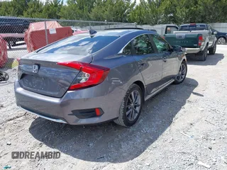 2021 Honda Civic Sedan EX with VIN 19XFC1F33ME012262, listed as a IAAI auction lot 41880047 with 67,861 mi miles. Bid and sale history available at carsss.com. Image 4.