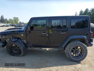 2015 Jeep Wrangler Unlimited Willys Wheeler with VIN 1C4BJWDG9FL750049, listed as a IAAI auction lot 42136188 with 115,328 mi miles and . Bid and sale history available at DreamBid. Image 15.