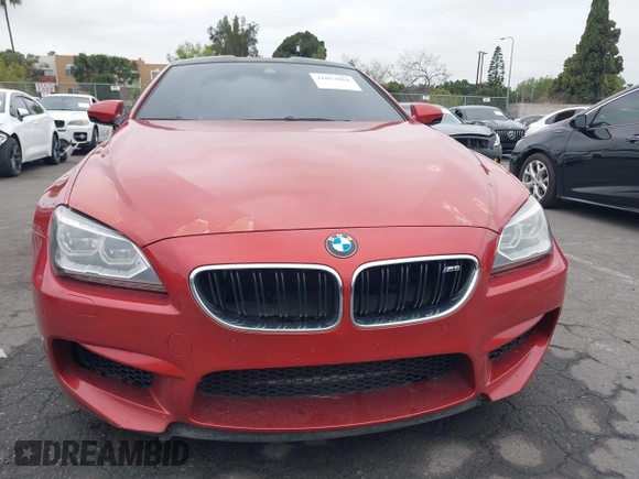 2013 BMW M6 z VIN WBSLX9C55DC968497, wystawiony jako IAAI lot #41863884 z przebiegiem 128 241 mil mil oraz . Historia ofert i sprzedaży dostępna na DreamBid. Obrazek 13.