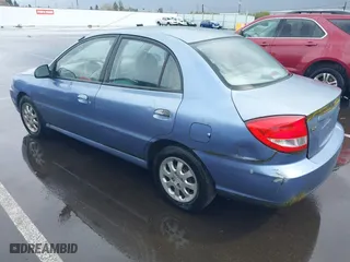 2003 Kia Rio with VIN KNADC125736227286, listed as a IAAI auction lot 41928174 with 151,431 mi miles. Bid and sale history available at carsss.com. Image 3.