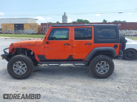 2015 Jeep Wrangler Unlimited Rubicon z VIN 1C4BJWFG4FL598033, wystawiony jako IAAI lot #42435523 z przebiegiem 134 202 mil mil oraz . Historia ofert i sprzedaży dostępna na DreamBid. Obrazek 14.