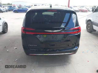 2023 Chrysler Pacifica Touring L with VIN 2C4RC1BG1PR550628, listed as a IAAI auction lot 42553430 with 61,773 mi miles and . Bid and sale history available at DreamBid. Image 17.