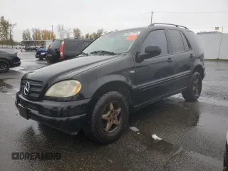 2001 Mercedes-Benz M-Class with VIN 4JGAB54E51A273024, listed as a Copart auction lot 80327264 with 211,120 mi miles and Salvage Title. Bid and sale history available at carsss.com. Image 1.