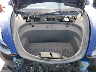 2023 Tesla Model 3 with VIN 5YJ3E1EA9PF697573, listed as a IAAI auction lot 41173833 with 6,966 mi miles. Bid and sale history available at carsss.com. Image 10.
