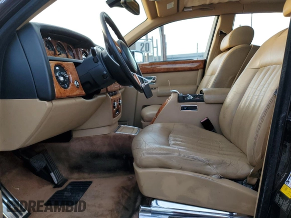 2006 Rolls-Royce Phantom z VIN SCA1S684X6UX08208, wystawiony jako Copart lot #77905764 z przebiegiem 108 986 mil mil oraz Szkody całkowita. Historia ofert i sprzedaży dostępna na DreamBid. Obrazek 7.