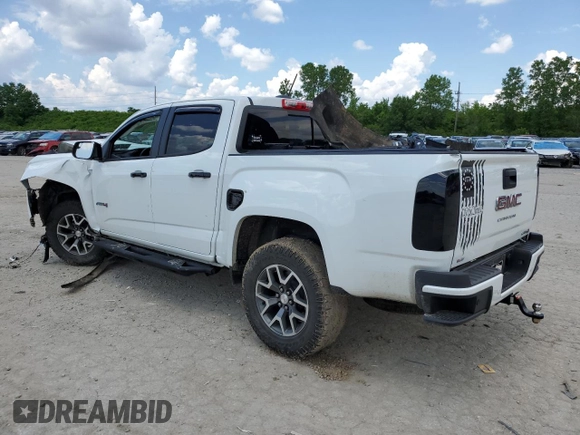 2021 GMC Canyon 4WD AT4 z VIN 1GTG6FEN9M1147406, wystawiony jako Copart lot #55454634 z przebiegiem 82 898 mil mil oraz Szkody całkowita. Historia ofert i sprzedaży dostępna na DreamBid. Obrazek 2.