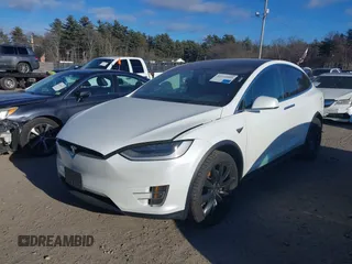 2021 Tesla Model X Long Range Plus with VIN 5YJXCDE29MF316169, listed as a IAAI auction lot 41232066 with 53,235 mi miles and . Bid and sale history available at carsss.com. Image 2.