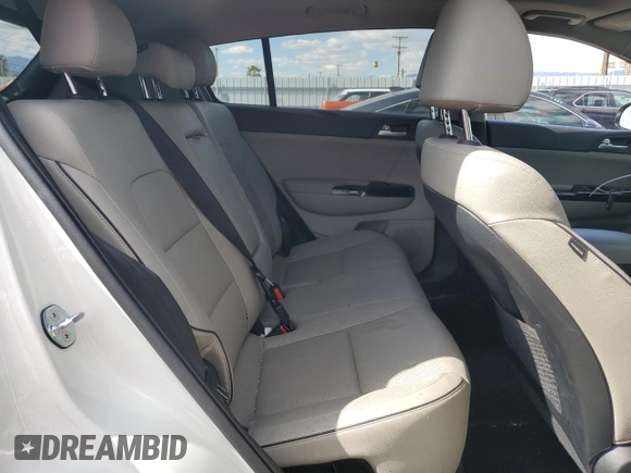 2020 Kia Sportage EX z VIN KNDPNCAC0L7805972, wystawiony jako Copart lot #52038825 z przebiegiem 65 794 mil mil oraz Szkoda całkowita • Salvage title. Historia ofert i sprzedaży dostępna na DreamBid. Obrazek 11.