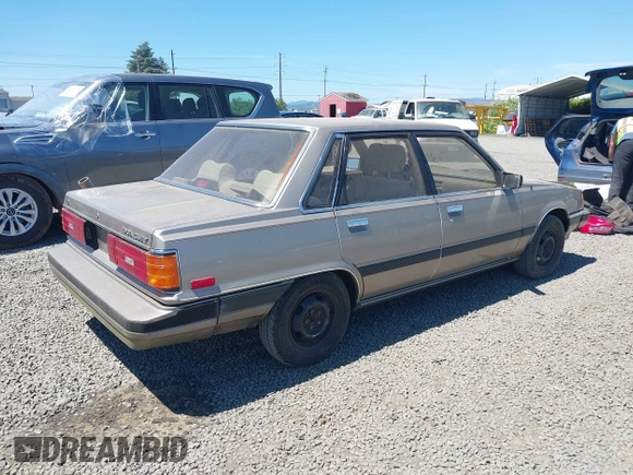 1986 Toyota Camry z VIN JT2SV16E1G0439200, wystawiony jako IAAI lot #42395141 z przebiegiem 159 698 mil mil oraz . Historia ofert i sprzedaży dostępna na DreamBid. Obrazek 4.