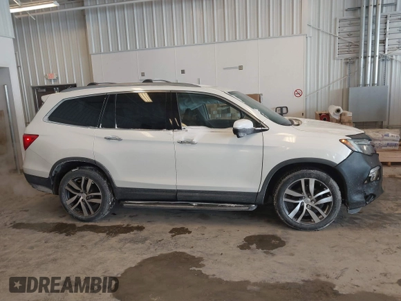2017 Honda Pilot Touring with VIN 5FNYF6H92HB032873, listed as a IAAI auction lot 41608870 with 123,888 mi miles. Bid and sale history available at carsss.com. Image 13.