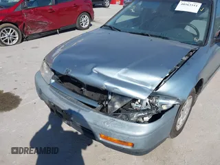 1995 Honda Accord DX with VIN 1HGCD562XSA045128, listed as a IAAI auction lot 40563511 with 143,206 mi miles. Bid and sale history available at carsss.com. Image 6.