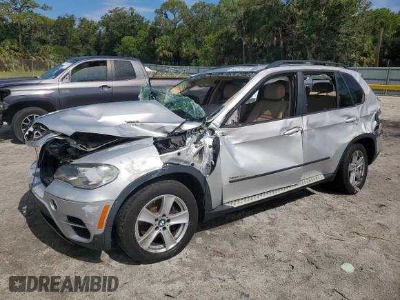 2012 BMW X5 35d with VIN 5UXZW0C51CL668064, listed as a Copart auction lot 62217845 with 140,544 mi miles and Salvage title. Bid and sale history available at DreamBid. Image 1.