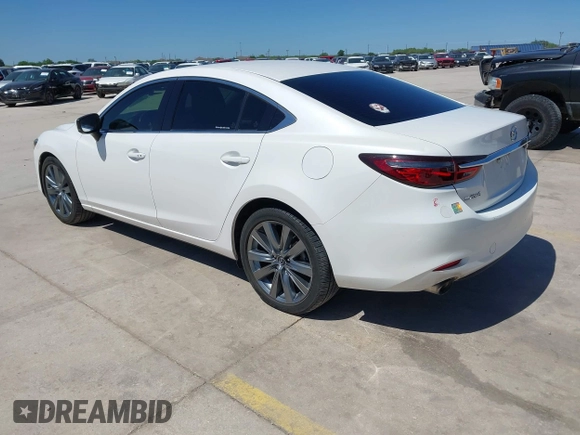 2021 Mazda 6 Touring with VIN JM1GL1VM4M1618686, listed as a IAAI auction lot 42079730 with 55,539 mi miles and . Bid and sale history available at DreamBid. Image 3.