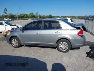 2009 Nissan Versa 1.8 S with VIN 3N1BC11E09L377706, listed as a IAAI auction lot 42027981 with 146,105 mi miles. Bid and sale history available at carsss.com. Image 14.