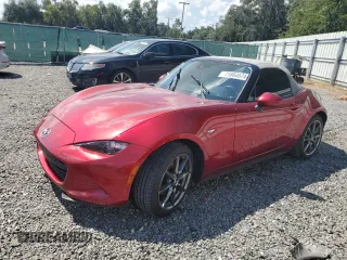 2020 Mazda MX-5 Miata Grand Touring z VIN JM1NDAD79L0415751, wystawiony jako Copart lot #71864574 z przebiegiem Nie podano mil oraz Szkoda całkowita • Salvage title. Historia ofert i sprzedaży dostępna na DreamBid. Obrazek 1.