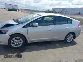2010 Honda Insight EX with VIN JHMZE2H71AS017996, listed as a IAAI auction lot 42091356 with 142,474 mi miles and . Bid and sale history available at DreamBid. Image 14.