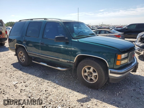 1999 GMC Yukon with VIN 1GKEC13R8XJ792078, listed as a Copart auction lot 50903294 with 232,672 mi miles and Salvage Title. Bid and sale history available at carsss.com. Image 4.