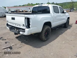 2021 Toyota Tacoma 4WD SR with VIN 3TMCZ5AN2MM414975, listed as a IAAI auction lot 41997227 with 57,729 mi miles. Bid and sale history available at carsss.com. Image 4.