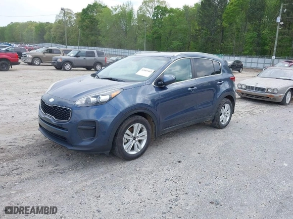 2018 Kia Sportage LX with VIN KNDPM3ACXJ7406034, listed as a IAAI auction lot 42007403 with 201,971 mi miles. Bid and sale history available at carsss.com. Image 2.