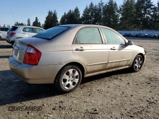 2006 Kia Spectra EX with VIN KNAFE122X65278395, listed as a Copart auction lot 51773205 with 243,978 mi miles and Salvage Title. Bid and sale history available at carsss.com. Image 3.