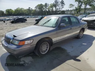 1999 Mercury Grand Marquis GS z VIN 2MEFM74W4XX656010, wystawiony jako Copart lot #51639785 z przebiegiem 239 627 mil mil oraz Szkoda całkowita • Salvage title. Historia ofert i sprzedaży dostępna na DreamBid. Obrazek 1.