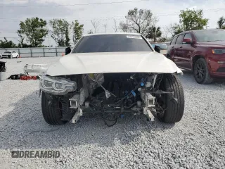 2018 BMW 3 Series 340i z VIN WBA8B3G53JNV00977, wystawiony jako Copart lot #53923065 z przebiegiem Nie podano mil oraz Tytuł czysty. Historia ofert i sprzedaży dostępna na DreamBid. Obrazek 5.