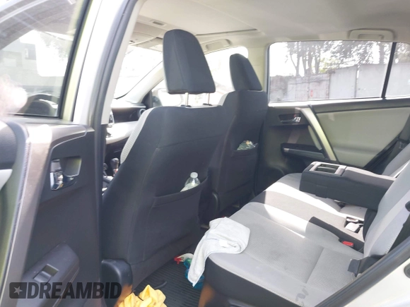 2016 Toyota RAV4 Hybrid XLE with VIN JTMRJREVXGD029019, listed as a IAAI auction lot 42021530 with 74,400 mi miles. Bid and sale history available at carsss.com. Image 21.