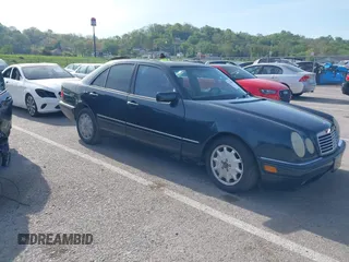 1997 Mercedes-Benz E-Class with VIN WDBJF55F7VJ027080, listed as a IAAI auction lot 42120838 with 150,197 mi miles. Bid and sale history available at carsss.com. Image 1.