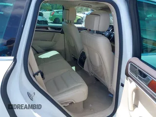 2012 Volkswagen Touareg Sport with VIN WVGEF9BP1CD008717, listed as a IAAI auction lot 42120641 with 211,580 mi miles and . Bid and sale history available at DreamBid. Image 8.