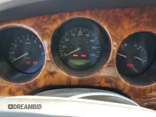 1997 Jaguar XK with VIN SAJGX5740VC014035, listed as a Copart auction lot 53066215 with 140,692 mi miles and Salvage Title. Bid and sale history available at DreamBid. Image 9.