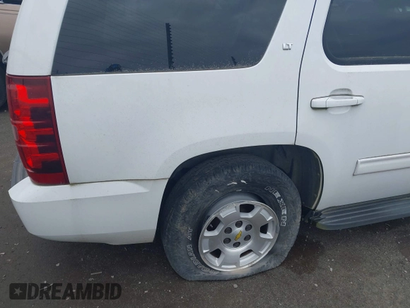 2011 Chevrolet Tahoe LT with VIN 1GNSCBE01BR146546, listed as a IAAI auction lot 39196597 with 206,906 mi miles and . Bid and sale history available at DreamBid. Image 4.