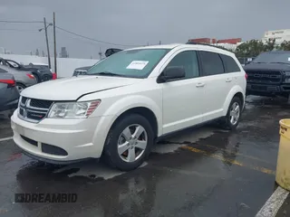 2013 Dodge Journey SE with VIN 3C4PDCAB1DT558033, listed as a IAAI auction lot 41804619 with 204,567 mi miles and . Bid and sale history available at carsss.com. Image 2.